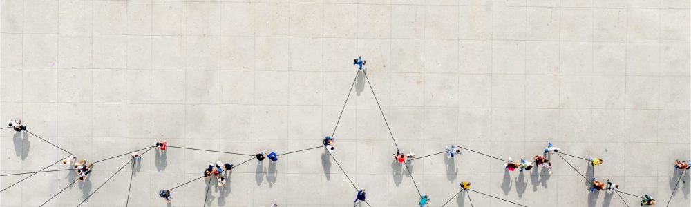 Crowd from above forming a growth graph with lines connecting between them to show how th COVID-19 can expand